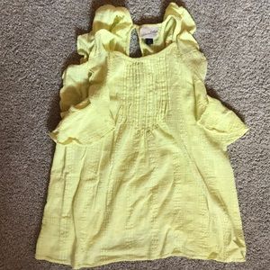 Cute flowy light yellow tank.